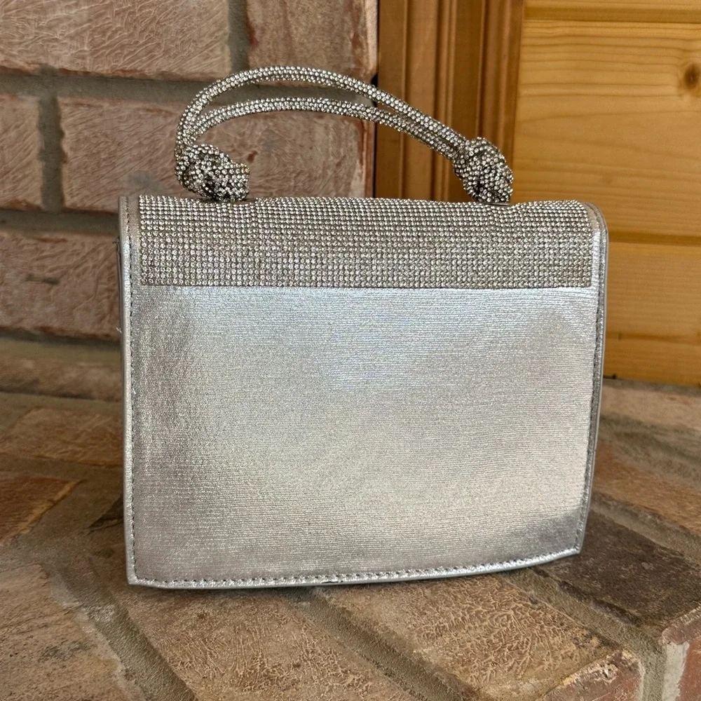 NWT Urban Expressions Silver Clutch/Purse with handle and matching chain straps.